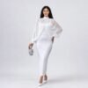 White chiffon cape-sleeve top with fitted white maxi skirt